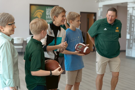 Sharing a fun moment with students and staff.