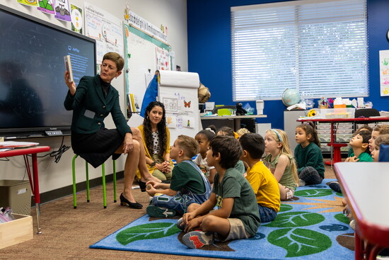 Ambler shares a story with eager learners.