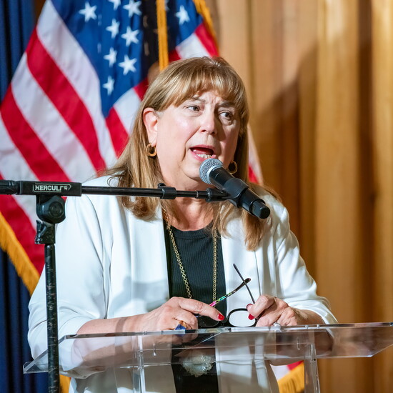 Cheryl Stritchik offers welcoming remarks at Boots & BBQ.