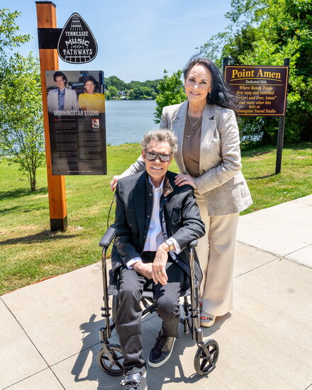 Randy and Mary Travis pose in front of the Morningstar and Point Amen markers.