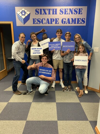 Dr. Bond and family have fun participating in an Escape Room exercise.