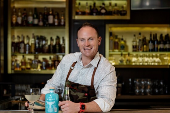 Chef Austin, behind the bar, showcases "Chef’s Water,” a variation of one of TRIS' gin and tonics made of Gray Whale Gin and Fever-Tree elderflower tonic.