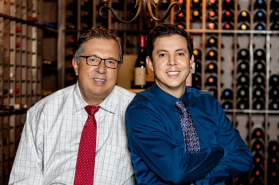 Carlos and Enrique Orioli amid 3,000 bottles of fine wine.