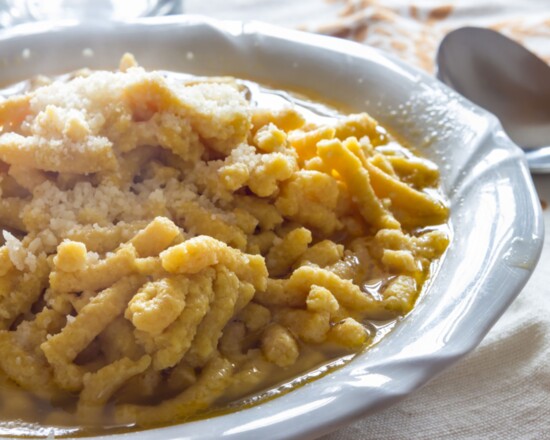 Nonna Elda enjoys making a traditional dish for her family, originating from the Emilia-Romagna region in Italy.