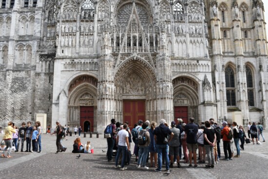 Despite suffering major damage during World War II, Rouen Cathedral has been painstakingly restored and draws large crowds.