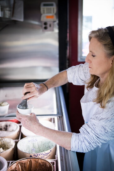 Pam Kachmar scoops out ice cream for customers.