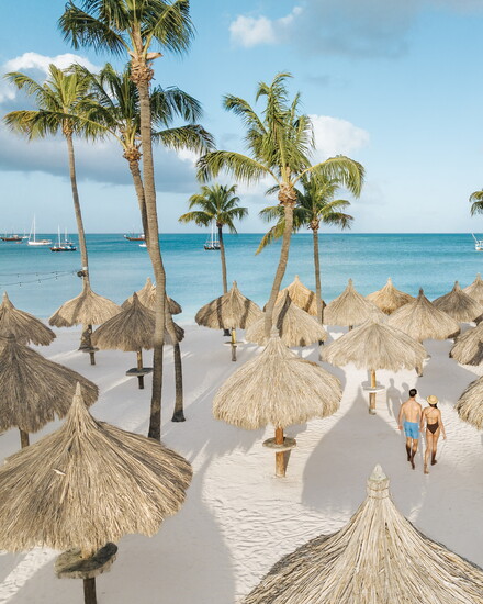 Guests can snorkel offshore, lounge poolside, or explore the island’s colorful neighborhoods.