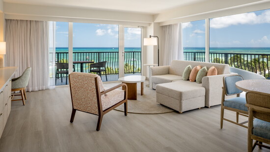 Spacious suites feature wraparound balconies and expansive ocean views.