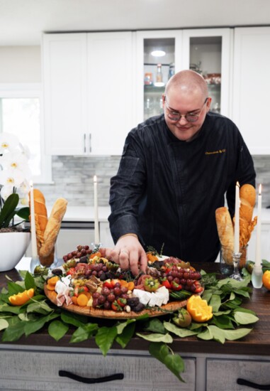 Crouch puts the finishing touches on one of his charcuterie masterpieces.