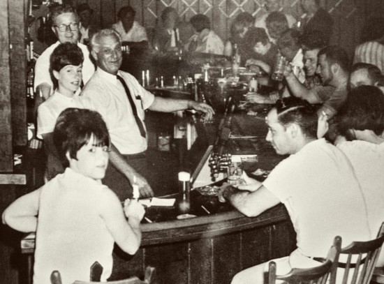 Grandfather Walt Kunisch at the bar with patrons