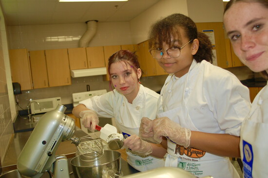 Working in teams is part of the culinary curriculum for these Mainland students