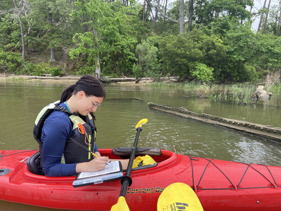 Chesapeake Conservation and Climate Corps member stream monitoring with National Oceanic and Atmospheric Association.
