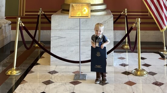 Maverick with his Apraxia Awareness Day Proclamation at the state capitol this year.