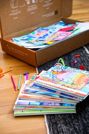 An Artkive box filled with art is transformed into custom books