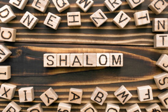 "Shalom" is a Hebrew word that means "peace," and it also  conveys a sense of wholeness, completeness, welfare, and harmony.