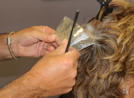 Joe coloring hair and adding highlights