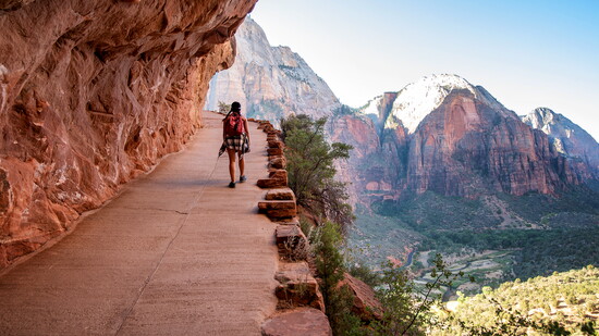 Hiker walking up Angel's Landing trail at Zion National Park in Springdale, Utah