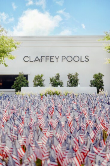 Memorial flag display outside the Claffey Pools design center