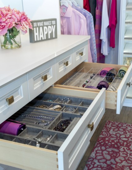 Customized drawer inserts create a personalized space.