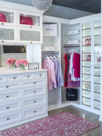 Walk-in closets create a fashion-meets-function space that feels like a personal boutique.