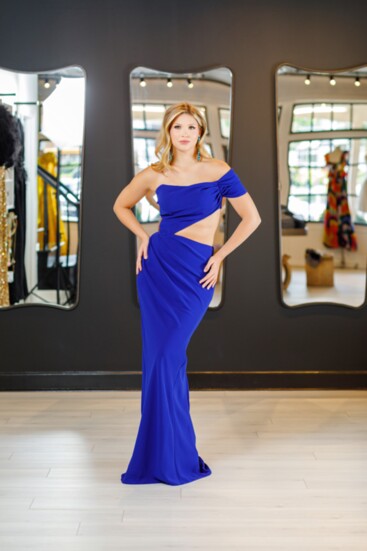 Charity Bowden wearing a royal blue, one-shouldered Tarik Ediz gown with Stefanie Somers earrings