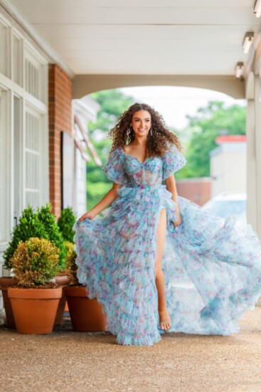 Miss Tennessee Teen USA, Blye Allen, wearing a blue, floral, Sherri Hill gown with Stefanie Somers earrings.
