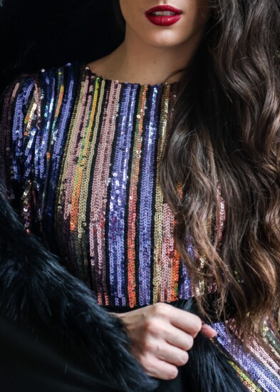Multi color art deco sequin dress with back V and velvet back bow from Just Me.  Faux fur wrap by Bella Chic.