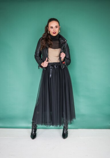 Tulle midi skirt with drawstring waist by Look Mode from Italy. Sheer black turtleneck and gold shimmer cami by Sage & Fig. Leather moto jacket from Mauritius.