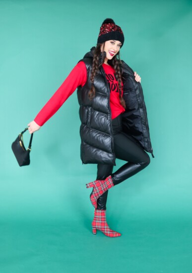 Black puffer vest by Mauritius.  Red “Holly Jolly” sentiment sweater.  Black faux leather jegging by RD International.