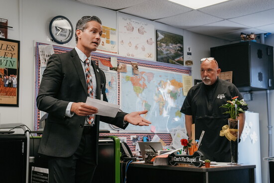 Sarasota County School Superintendent Terry Connor reads the Ripple Effect award nomination for Venice High School teacher and coach Sascha Hyer.