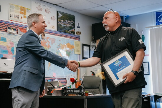 Barancik Foundation's Greg Luberecki presents Sascha Hyer with Barancik Foundation’s Ripple Effect Teacher Award.