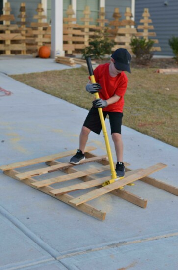 1. Collin breaks down a pallet.  Individuals and companies have donated pallets.