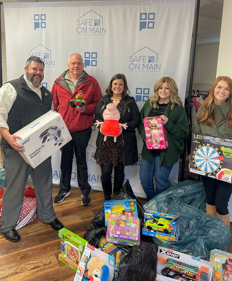 From L to R: Board members Chad Bridgman, Mike Geygan, and Abby Melampy delivering toys for the 2024 SAFE on Main Annual Toy Drive. 
