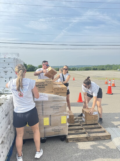 Staff from Kings Local School District assist Shared Harvest with a food distribution during the 2025 Community Care Day.