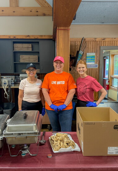 United Way of Warren County staff members volunteered at their partner agency, Camp Joy, serving food to camp attendees. 