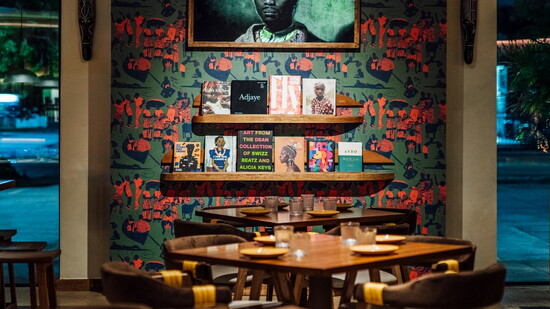 Honoring traditional West African Aso Oke fabric, the bar and tables showcase Shade Akanbi’s design for ClayImports, with custom Objecktfab tables.