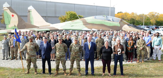 Col. Corona (center) with her group at Wright-Patterson AFB in front of an "acquired MIG."