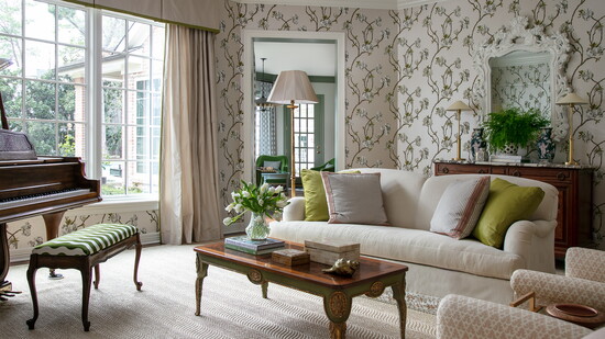 Wallpaper with a soft floral pattern creates a serene setting in this music room. Styled by Curious Details