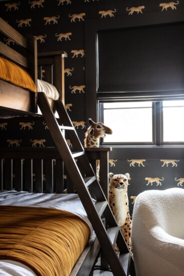 A children's room features playful wallpaper by Caitlin McGauley