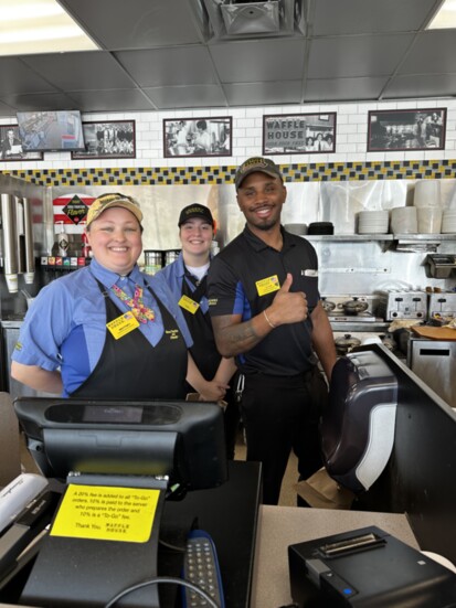 Brittney Agee, Katie Brown and District Manger Chris