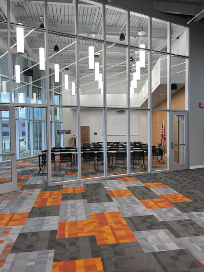 The Community Room is a reservable space with a variety of seating options + a kitchenette. 