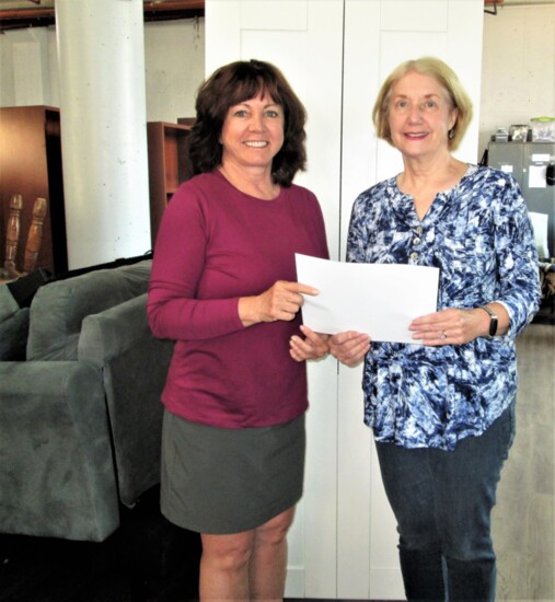 CWP Executive Director Glenda Brion (left) accepted the award, presented by Anne Anderko, a past AAUW branch president and CWP volunteer.