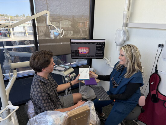 Dr. Simpson reviewing Invisalign Treatment