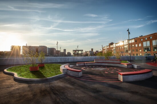 At a Copenhagen, Denmark train station, seating is combined with a working sundial, created with ScandiCurb machines, distributed by Rob Huffman in the U.S.