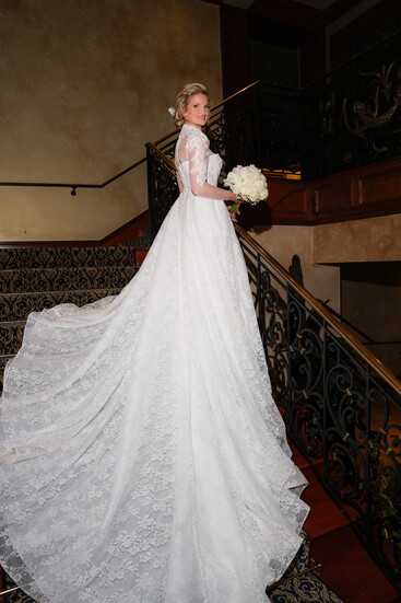 Julia stunned in a Milla Nova dress, seen here cascading down the interior steps of Sale e Pepe.