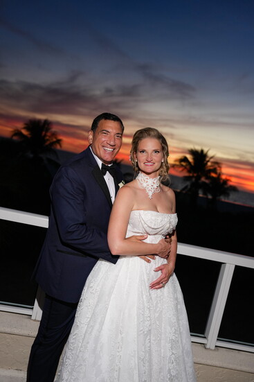 Rick & Julia enjoy the evening with guests as the sky turned gold and orange over the moonlit Gulf.