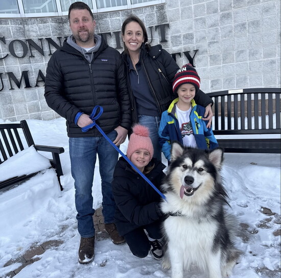 A family adopts a pet at the Connecticut Humane Society
