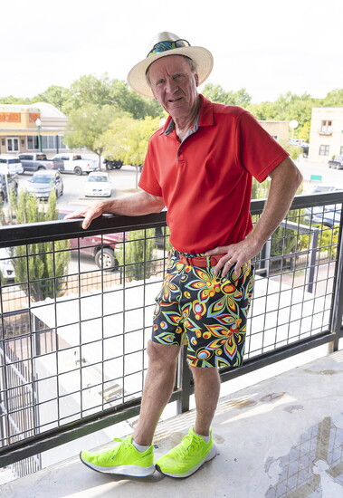 Harry greets guests from the patio overlooking downtown Conroe.