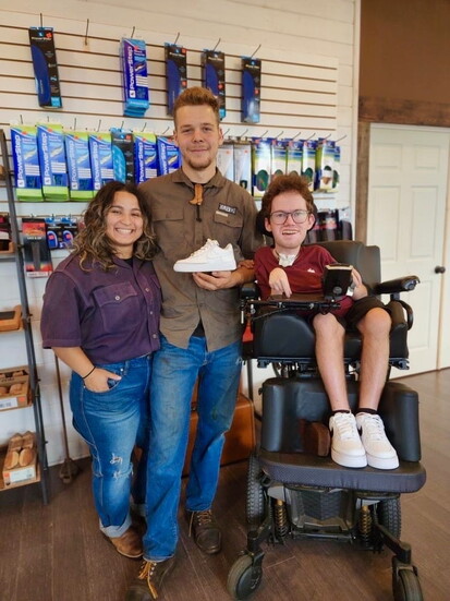 Aaron with Oliver and Angel Garner, owners of Shoe Man with Angel's Custom Creations
