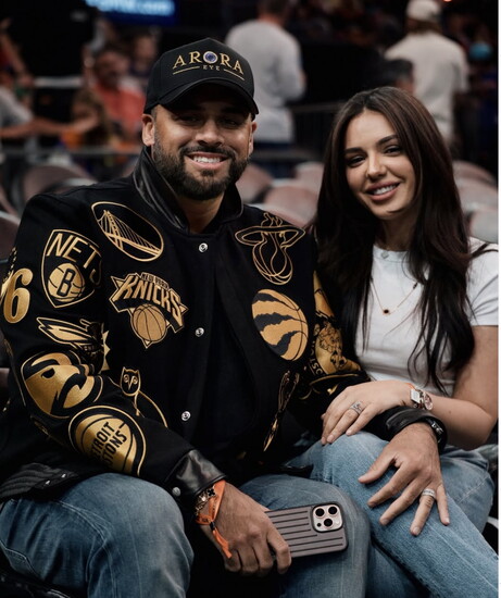 Courtside with his wife